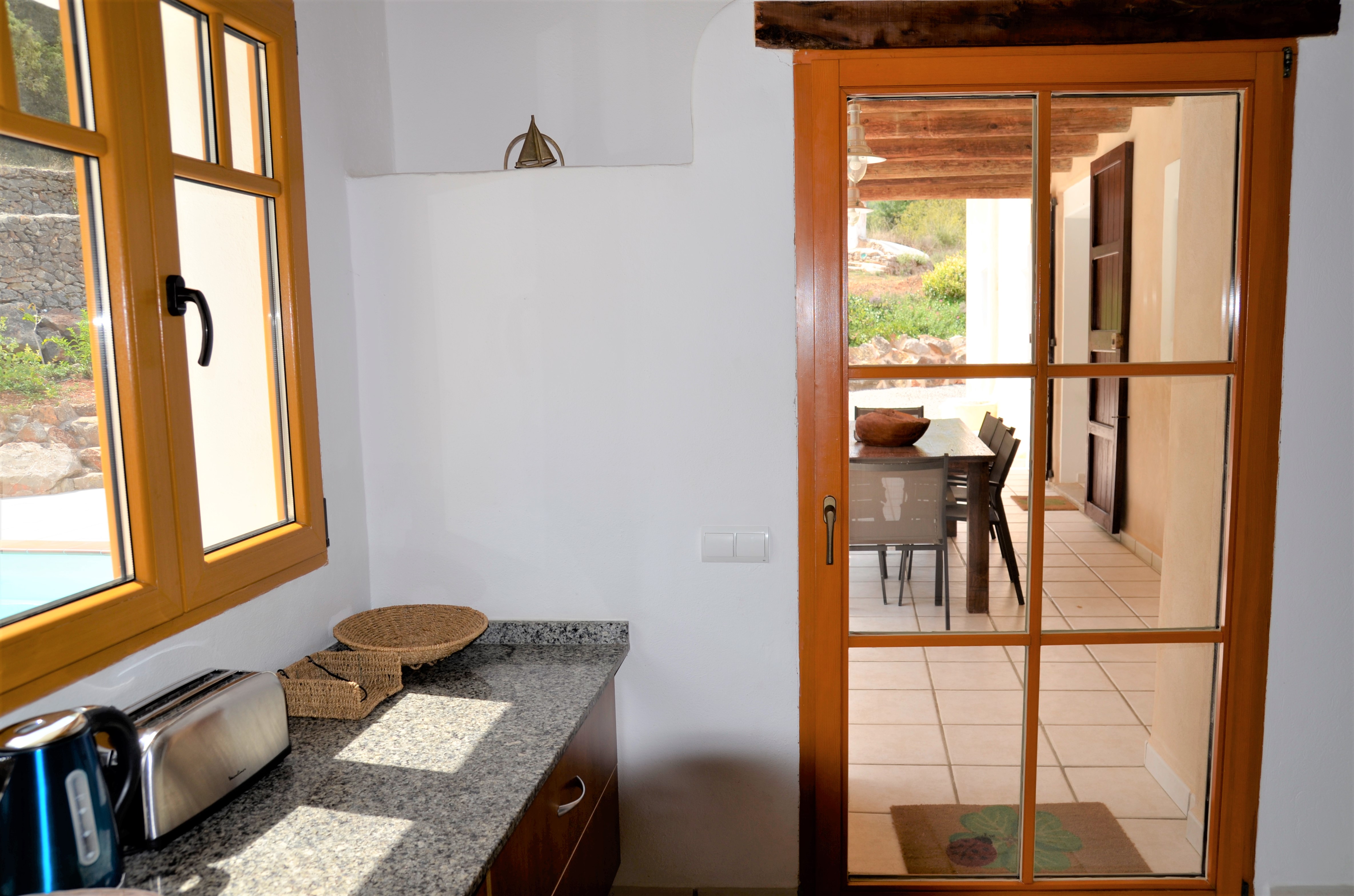 Ibiza rental villa rv collexion 2022 finca san jose verg family kitchen and terrace.jpg